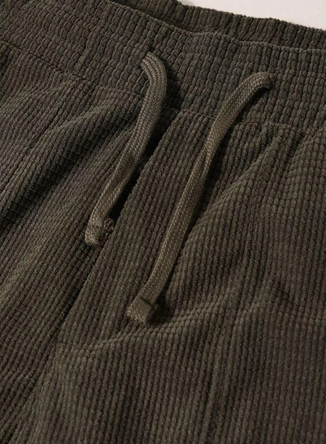 The Indian Garage Co  Men Loose Fit Solid Cargo Pocket Mid-Rise Joggers for Men | Best Price UAE